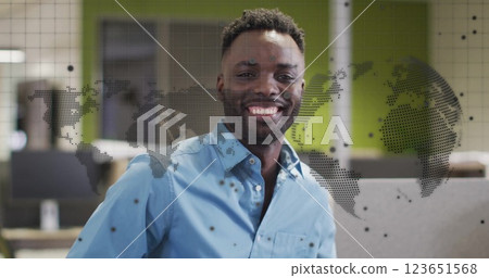 Image of globe and digital data processing over african american businessman in office 123651568