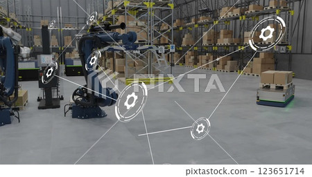 Image of network of connections with icons over machines working in warehouse 123651714
