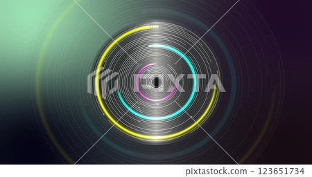 Image of glowing circles of light spinning on black background 123651734