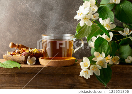Herbal tea and blooming jasmine branch. 123651806