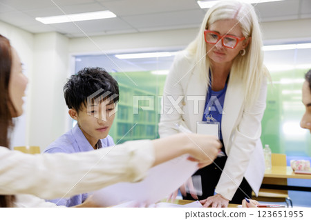 Students being taught by foreign teachers Students being taught by foreign teachers 123651955