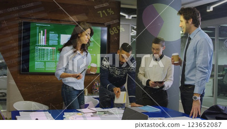 Image of financial data processing over diverse business people in office Image of financial data processing over diverse business people in office 123652087