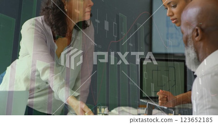 Image of financial data processing over diverse business people in office Image of financial data processing over diverse business people in office 123652185