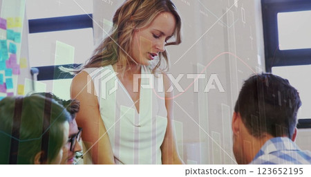 Image of financial data processing over diverse business people in office Image of financial data processing over diverse business people in office 123652195
