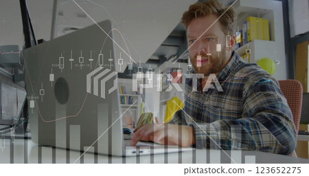 Image of financial data processing over caucasian businessman using laptop in office Image of financial data processing over caucasian businessman using laptop in office 123652275
