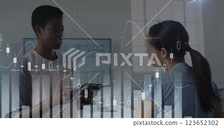 Image of financial data processing over diverse business people in office Image of financial data processing over diverse business people in office 123652302
