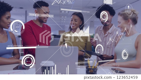 Image of financial data processing over diverse colleagues having meeting in office Image of financial data processing over diverse colleagues having meeting in office 123652459