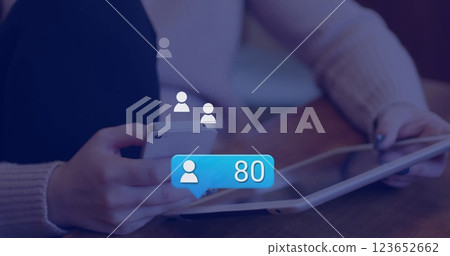 Image of digital icons processing over caucasian woman using tablet 123652662