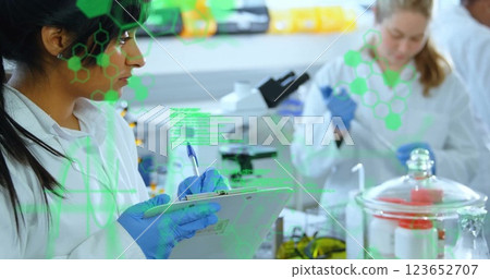 Image of scientific data processing over biracial female scientist in laboratory 123652707