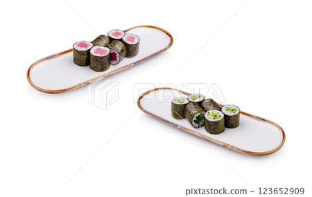 Sushi rolls presented on elegant plates with vibrant colors Sushi rolls presented on elegant plates with vibrant colors 123652909