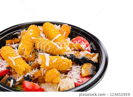 Crispy chicken tenders served with fresh vegetables and cheese 123652959
