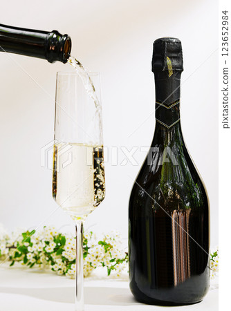 Sparkling wine being poured into a flute for celebration Sparkling wine being poured into a flute for celebration 123652984