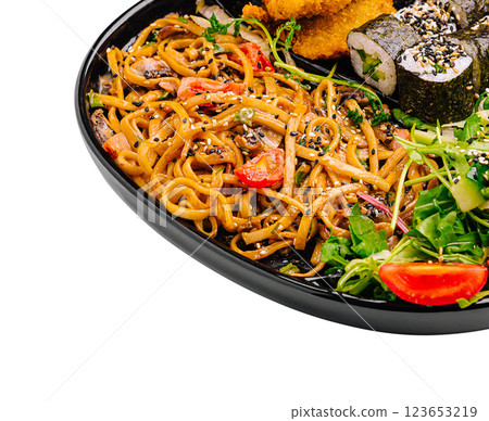 Delicious Asian cuisine featuring noodles, sushi, and vegetables Delicious Asian cuisine featuring noodles, sushi, and vegetables 123653219