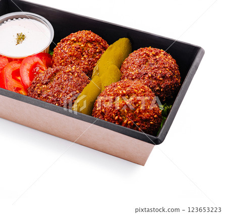 Delicious falafel platter with fresh vegetables and dip 123653223