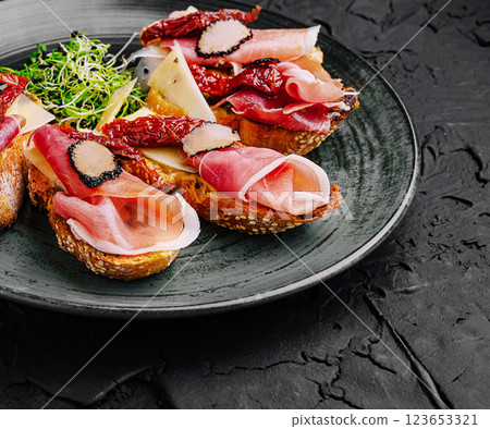 Handcrafted gourmet crostini with assorted meats and vegetables Handcrafted gourmet crostini with assorted meats and vegetables 123653321