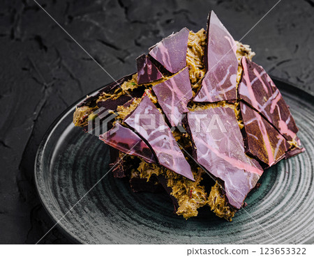 Chocolate dessert artfully arranged on a plate Chocolate dessert artfully arranged on a plate 123653322