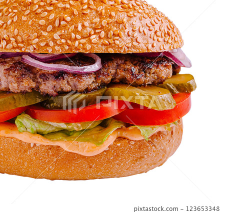 Juicy burger with fresh veggies and creamy sauce on sesame bun 123653348