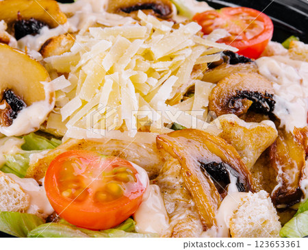 Fresh caesar salad with grilled chicken close-up 123653361