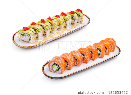 Delicious sushi rolls arranged on elegant platters for dining Delicious sushi rolls arranged on elegant platters for dining 123653422