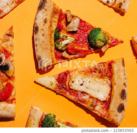 Colorful vegetable pizza slices arranged on bright background 123653503
