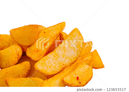 Crispy potato wedges prepared with spices on a white background 123653517