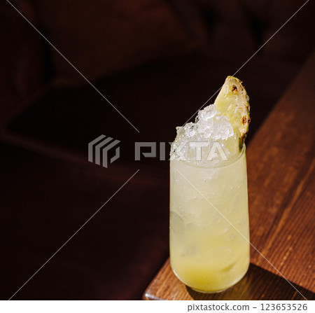 Refreshing cocktail with crushed ice and fruit garnish Refreshing cocktail with crushed ice and fruit garnish 123653526