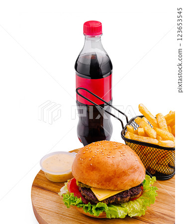 Delicious hamburger with fries and cola on a wooden platter 123653545