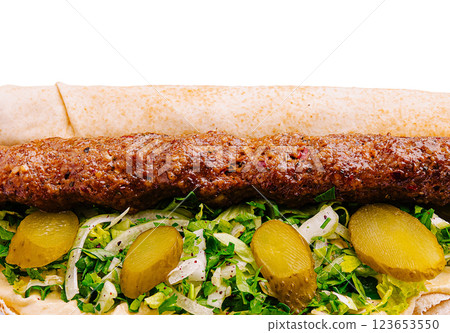 Delicious kebab wrap with fresh vegetables and pickles 123653550