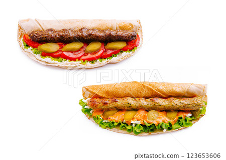 Delicious wraps featuring grilled meat and fresh vegetables Delicious wraps featuring grilled meat and fresh vegetables 123653606