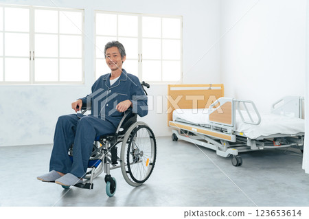 Smiling senior man in a wheelchair 123653614