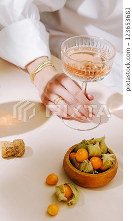 Elegant gathering with sparkling drink and fresh fruit on table Elegant gathering with sparkling drink and fresh fruit on table 123653681