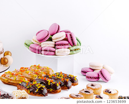 Colorful display of macarons and pastries at a dessert table 123653699