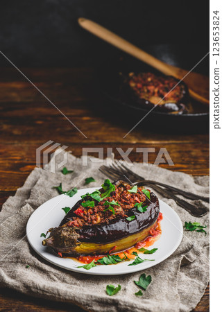 Eggplant stuffed with ground beef and tomatoes 123653824
