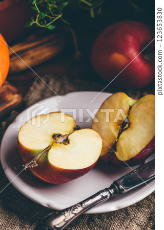 Two Halves of Red Apple on White Plate Two Halves of Red Apple on White Plate 123653830