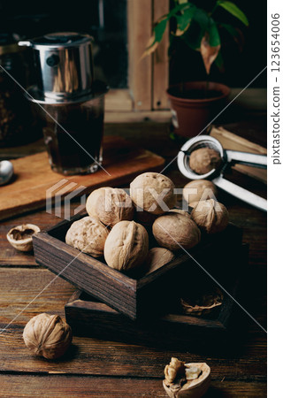 Walnuts in small wooden box Walnuts in small wooden box 123654006