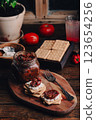 Light snack with crackers, sun-dried tomatoes and cream cheese 123654256