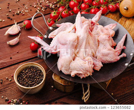 Fresh chicken wings prepared for cooking with spices and vegetables 123655082
