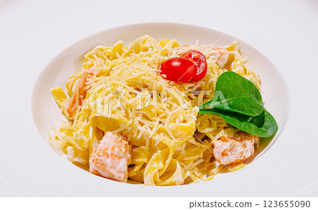 Creamy pasta dish with salmon, cherry tomatoes, and spinach Creamy pasta dish with salmon, cherry tomatoes, and spinach 123655090