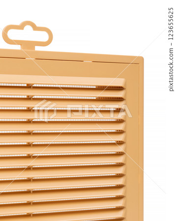 Ventilation grate isolated on a white background. Material plastic. Color orange. Close-up. 123655625