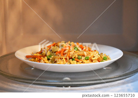 Vegetable egg fried rice in microwave. 123655710