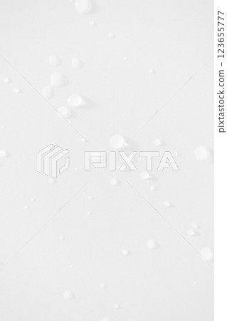 Water drops minimal white background vertical. Moisturizing and hydrating skincare Water drops minimal white background vertical. Moisturizing and hydrating skincare 123655777