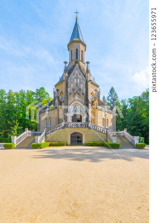 The Schwarzenberg Tomb stands majestically in Domanin, Czechia, showcasing impressive architecture surrounded by lush greenery during a clear day. The Schwarzenberg Tomb stands majestically in Domanin, Czechia, showcasing impressive architecture surrounded by lush greenery during a clear day. 123655971