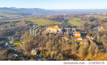 Grabstejn Castle rises majestically on a sunny day, surrounded by lush greenery and rolling hills in Czechia. The sunlight highlights its historical architecture, inviting exploration. Grabstejn Castle rises majestically on a sunny day, surrounded by lush greenery and rolling hills in Czechia. The sunlight highlights its historical architecture, inviting exploration. 123656578