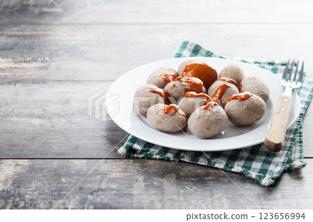 Papas arrugadas with mojo on wooden table. Traditional Canary Islands food. 123656994