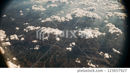 Beijing, China. View From Airplane Window On Mountainous Landscape Of China. Light Haze Clouds Over Ground Mountainous Terrain. Travel China. Aerial View On Mountainous Terrain. Porthole View Or 123657927