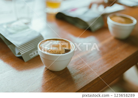 Barista preparing to test and inspecting the quality of coffee Barista preparing to test and inspecting the quality of coffee 123658289