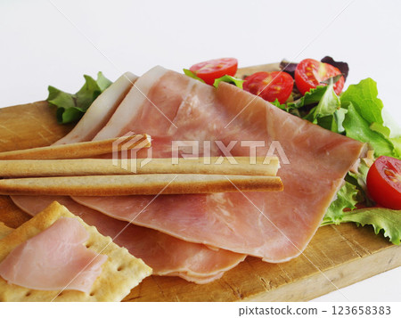 sliced ham grissini cooked ham ham wine snacks hors d'oeuvres italy 123658383