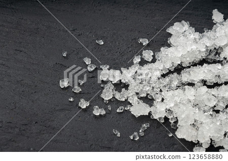 Dead sea salt pile, white crystals for body spa, sodium chloride similar to crushed ice, spa scrub Dead sea salt pile, white crystals for body spa, sodium chloride similar to crushed ice, spa scrub 123658880