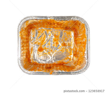 Empty aluminium foil tray isolated, lasagne food remains in dirty packaging for heating, food waste 123658917