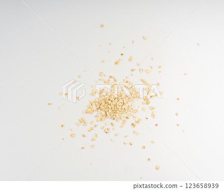 Dry raw oat flakes isolated, rolled flat grains, instant porridge, thin cereals, flattened grains group Dry raw oat flakes isolated, rolled flat grains, instant porridge, thin cereals, flattened grains group 123658939